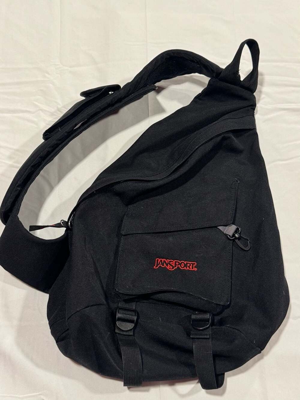 JanSport Black Sling Crossbody One Shoulder Backpack, adjustable strap